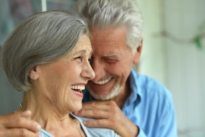 older couple at home laughing