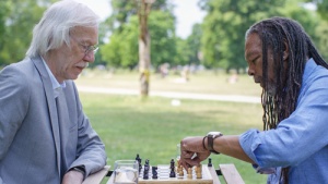 Two Seniors Playing Chess with Friendly Visitor Program