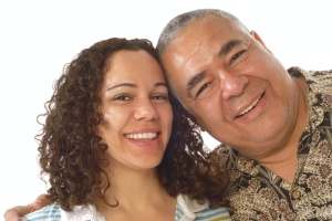 father and daughter smiling who is Caring For Aging Parents