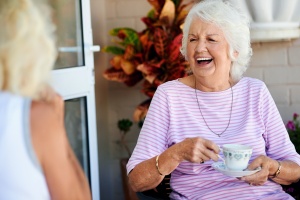 women laughing while she is Aging In Place